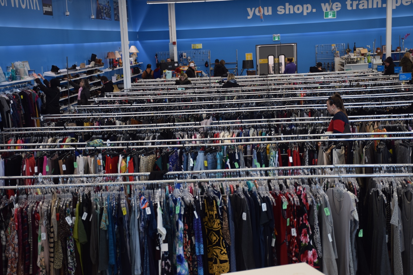 Racks of second-hand clothing inside Goodwill Waterloo
